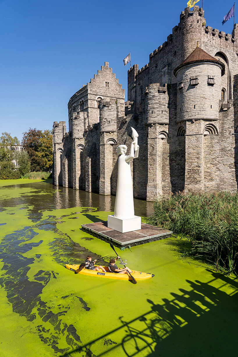     zweintopf’s white inflatable sculpture stands on the moat beside Gravensteen in Ghent