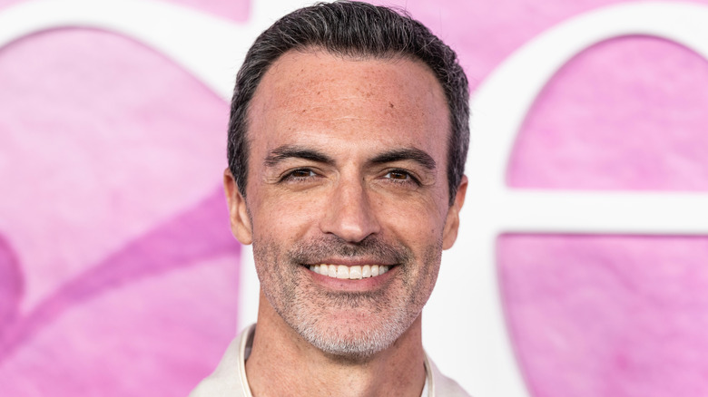 Reid Scott smiling at Hollywood event