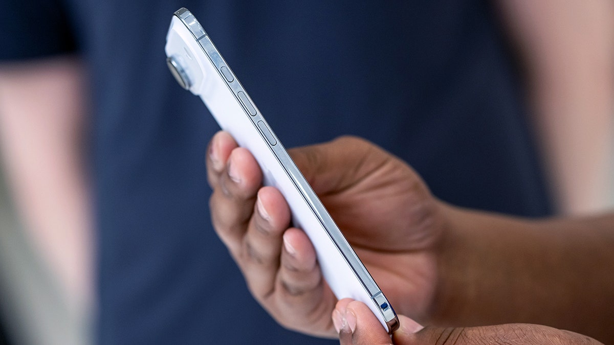Person typing on their phone.