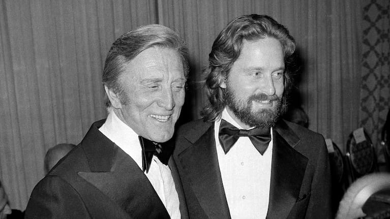 Kirk Douglas, left, appears with his son Michael Douglas at a Friar's Club dinner in 1977.