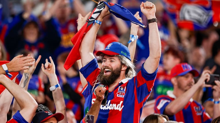 Knights fans celebrate the try of Kalyn Ponga of the Knights during the 2026 NRL grand final match between the Sydney Roosters and the Newcastle Knights at Accor Stadium in Sydney, Sunday, October 4, 2026