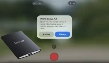 Phone camera screen showing an iPhone Storage Full alert next to a black Lexar portable SSD in the foreground