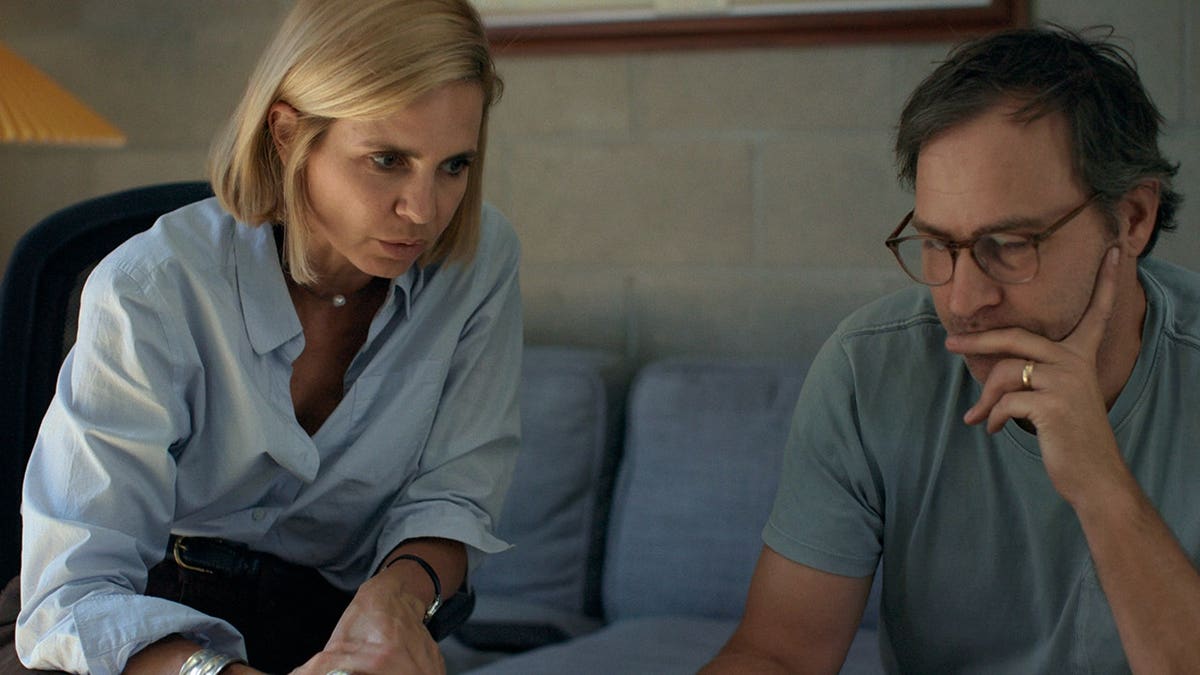 Mariana van Zeller and Jeff Plunkett speak on the phone with a National Geographic executive.