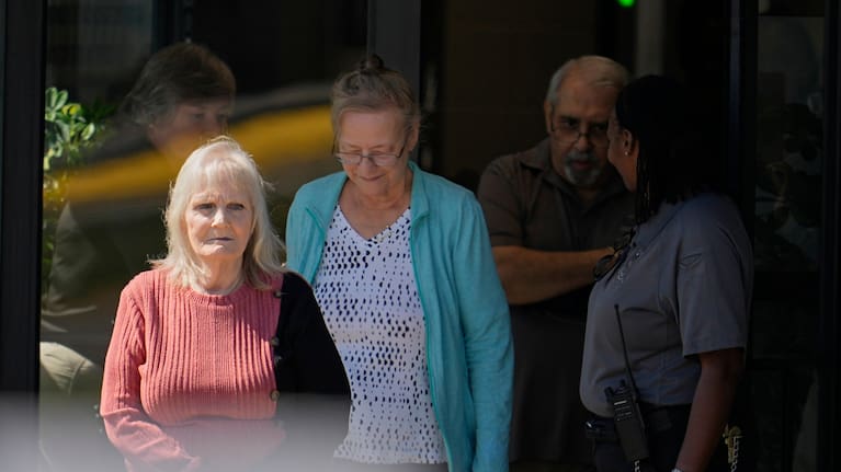May Martinez, left, mother of murder victim Colleen Slemmer, walks out of Riverbend Maximum Security Institution during a stay of the planned execution of Christa Pike