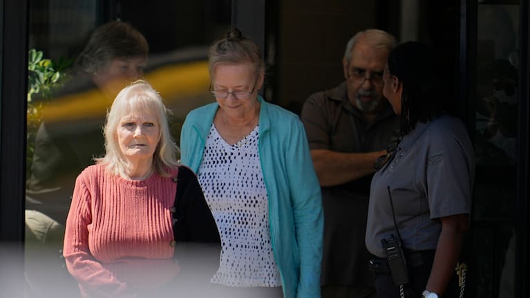 May Martinez, left, mother of murder victim Colleen Slemmer, walks out of Riverbend Maximum Security Institution during a stay of the planned execution of Christa Pike