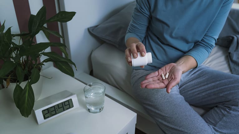 A person with melatonin tablets (file image).