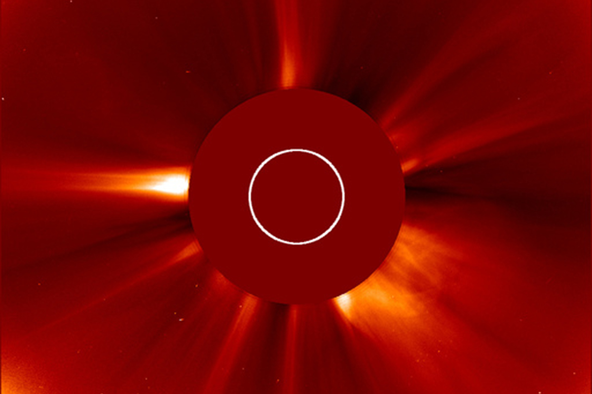 A view of the Sun's corona captured by the SOHO spacecraft on 3 April 2024. The large red disc in the centre is the coronagraph. Credit: NASA/ESA/SOHO