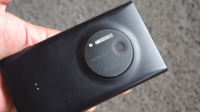 Nokia Lumia 1020 shown from the back with its large camera module visible.