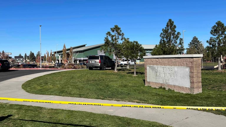 Police tape and cordons are in place around Silver Rail Elementary School in Oregon.