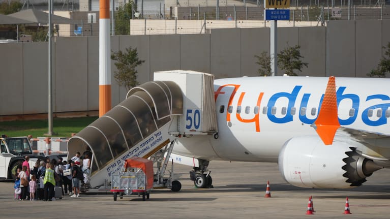 Passengers embark on a FlyDubai aircraft at Ben Gurion International Airport, near Tel Aviv, Israel.