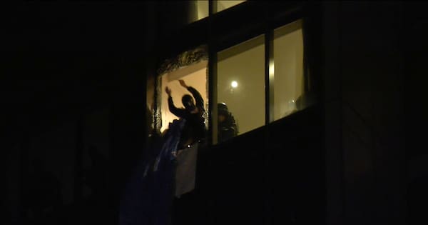 Dramatic footage shows rescue of base jumper from side of Auckland high-rise
