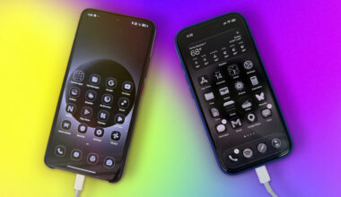 Two smart phones with the home screen visible. The screens look monochromatic (with a pop of green from the battery indicator).