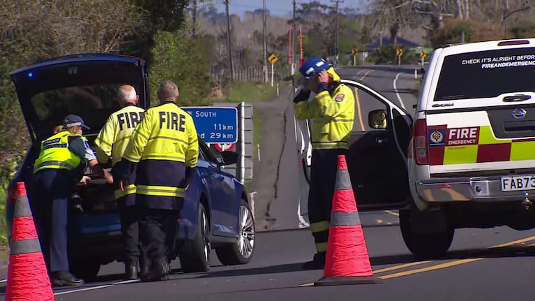 Police and fire officers near a crash at Dairy Flat, in the north of Auckland.
