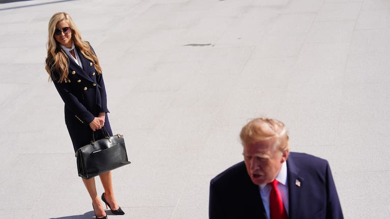 President Donald Trump speaks to the reporters as he walks to board Marine One on the South Lawn of the White House.