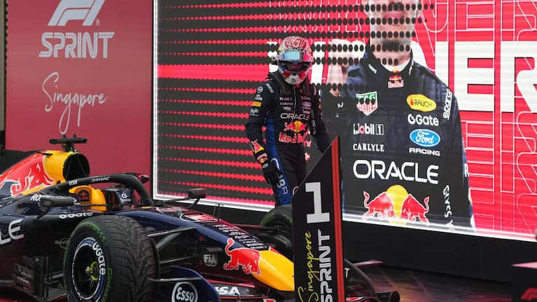 Red Bull driver Max Verstappen of the Netherlands looks at his car after finishing first in the sprint race ahead of the Singapore Formula One Grand Prix in Singapore.