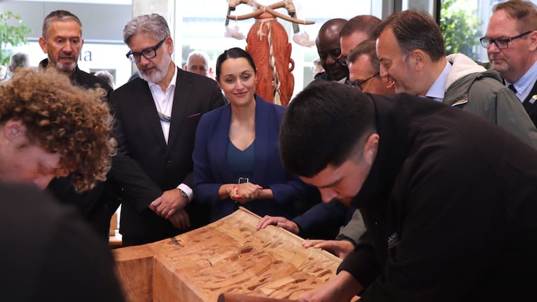 Rotorua Mayor Tania Tapsell watches the waka being carved at the New Zealand Māori Arts and Crafts Institute at Te Puia, Rotorua.