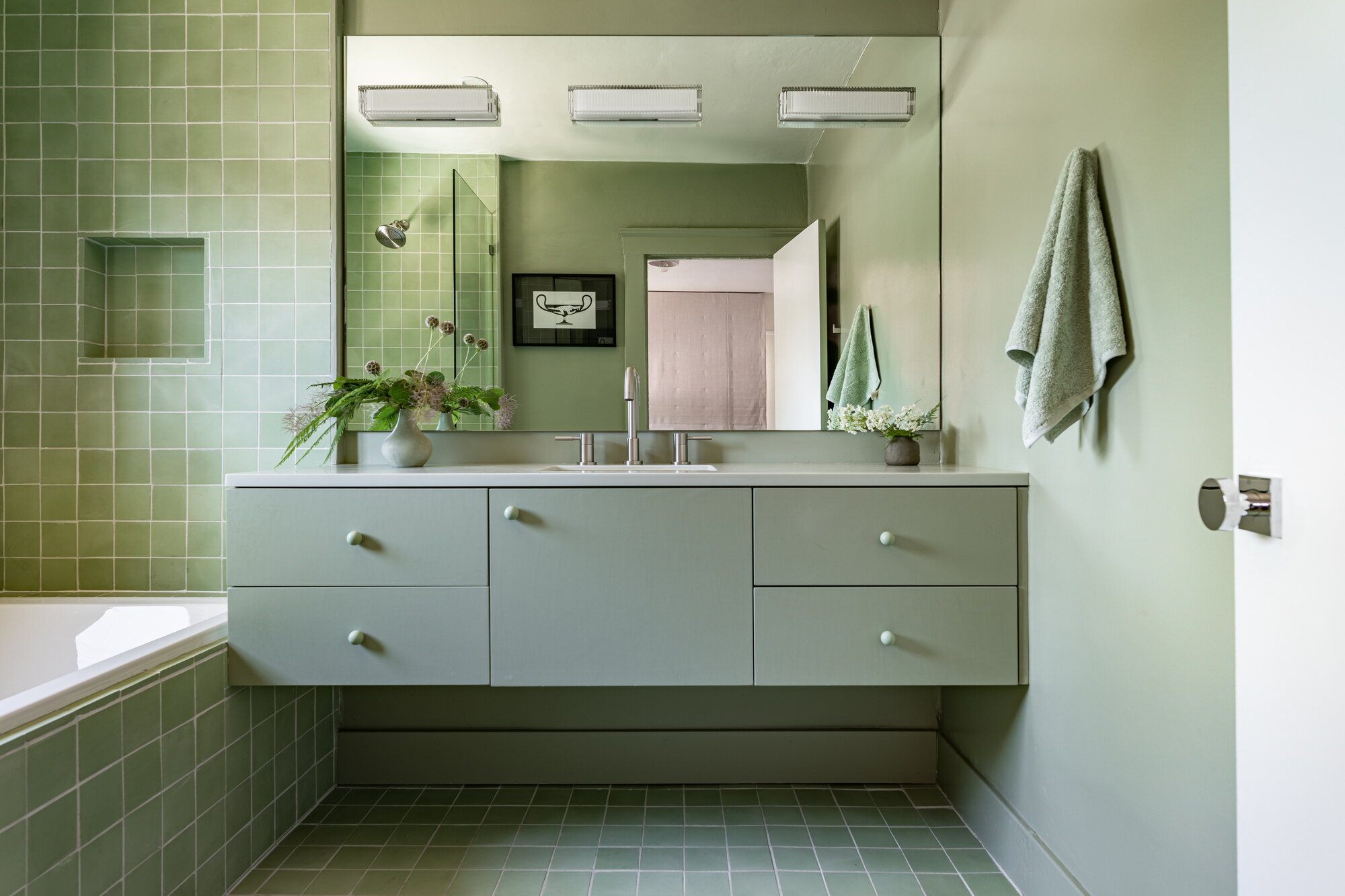 A sage green bathroom