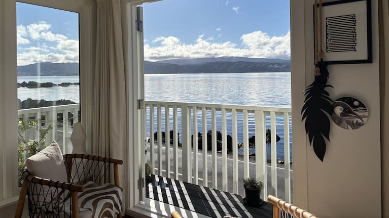 Sharman Buckle's living room looks out over Karaka Bay, Wellington.