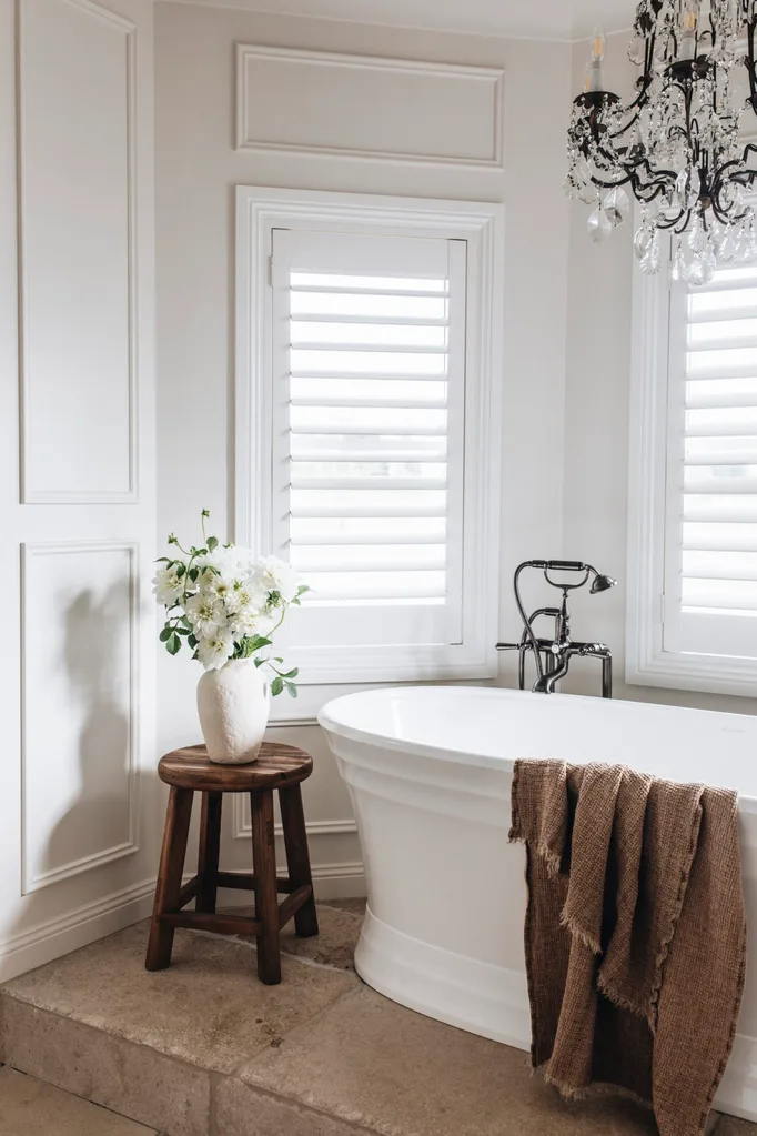 A white bathroom with a freestanding tub