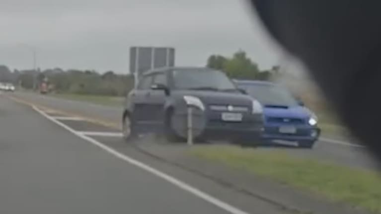 The vehicles collided as one appeared to overtake the other, striking a sign. 