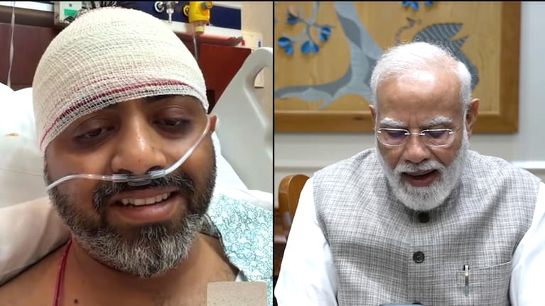 This screengrab from Narendra Modi YouTube Channel shows Indian Prime Minister Narendra Modi speaking with FlyDubai pilot Captain Smit Machchhar. 