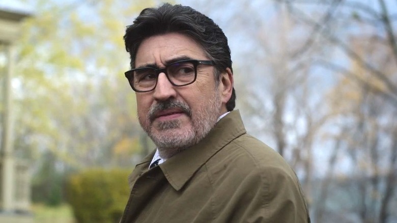 Armand Gamache (Alfred Molina) standing outside on 