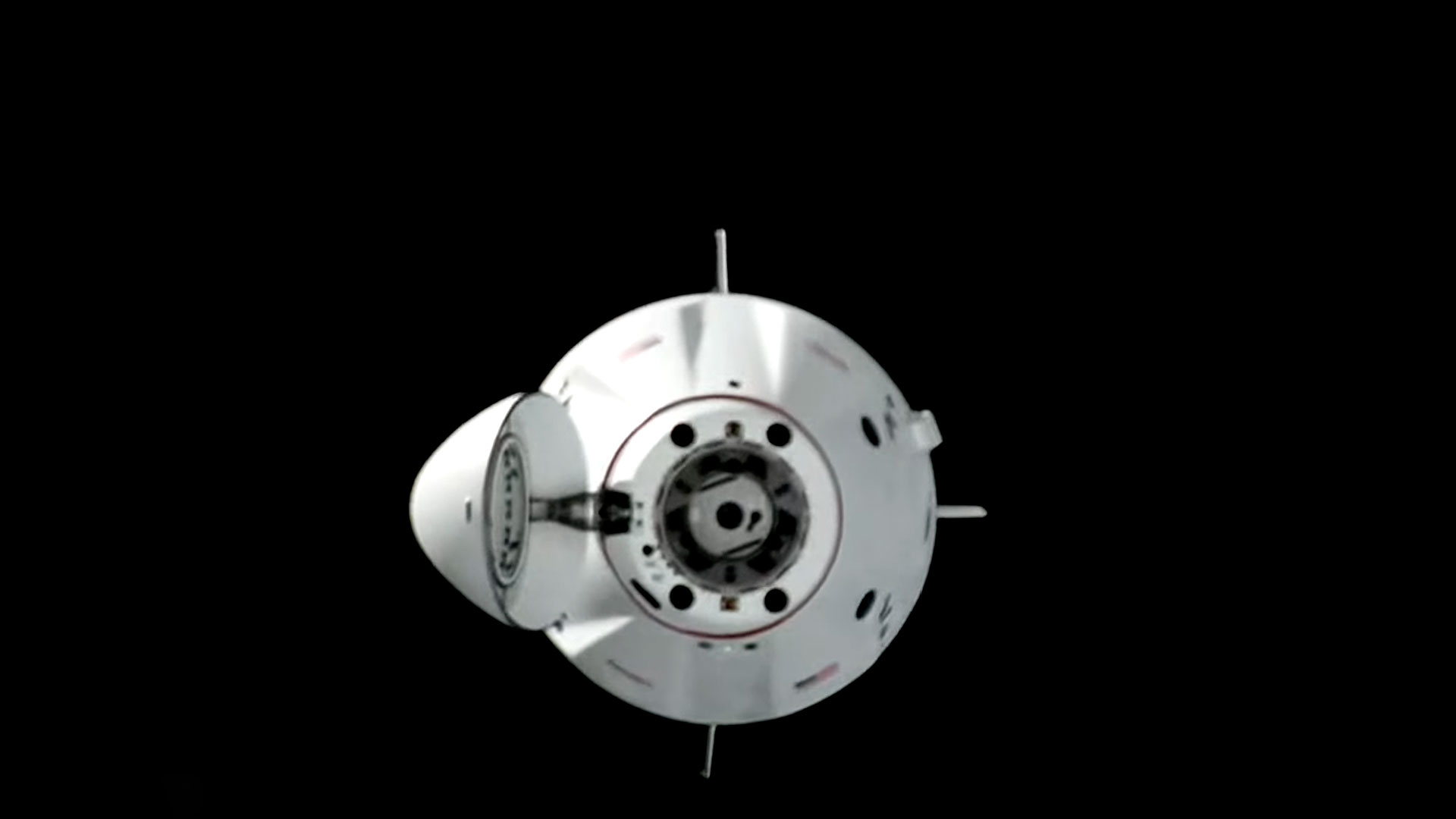a space capsule is seen on approach to a docking