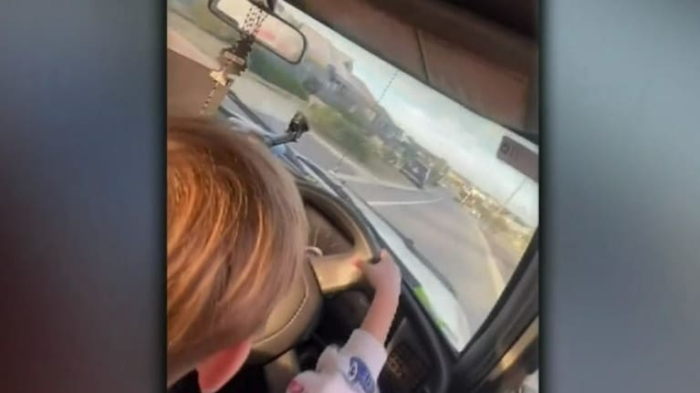 Video showed the unrestrained three-year-old sit on the man's lap, steering the vehicle on a residential street.  