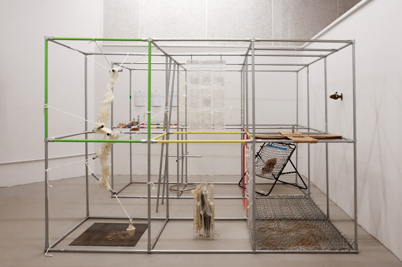 metal pipe grid transforms personal rituals of control into participatory playground - 1
