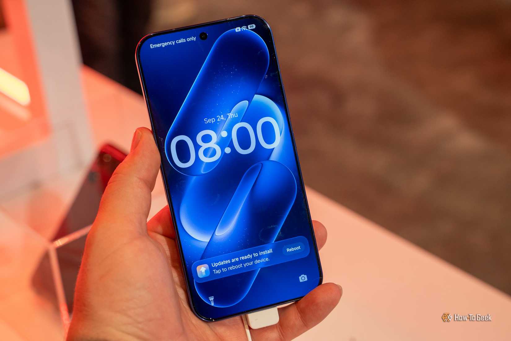 Xiaomi smartphone front display held at Snapdragon Summit.