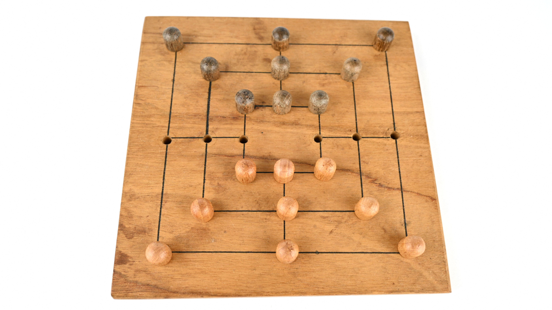 a wooden board with 24 holes and 3 concentric squares and 18 pegs