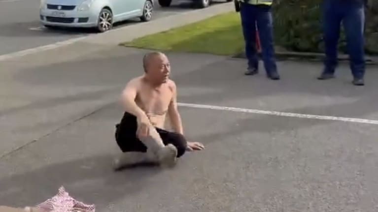 Zhi removed his shirt during a protest at Environment Southland last month. (Source: Screenshot)