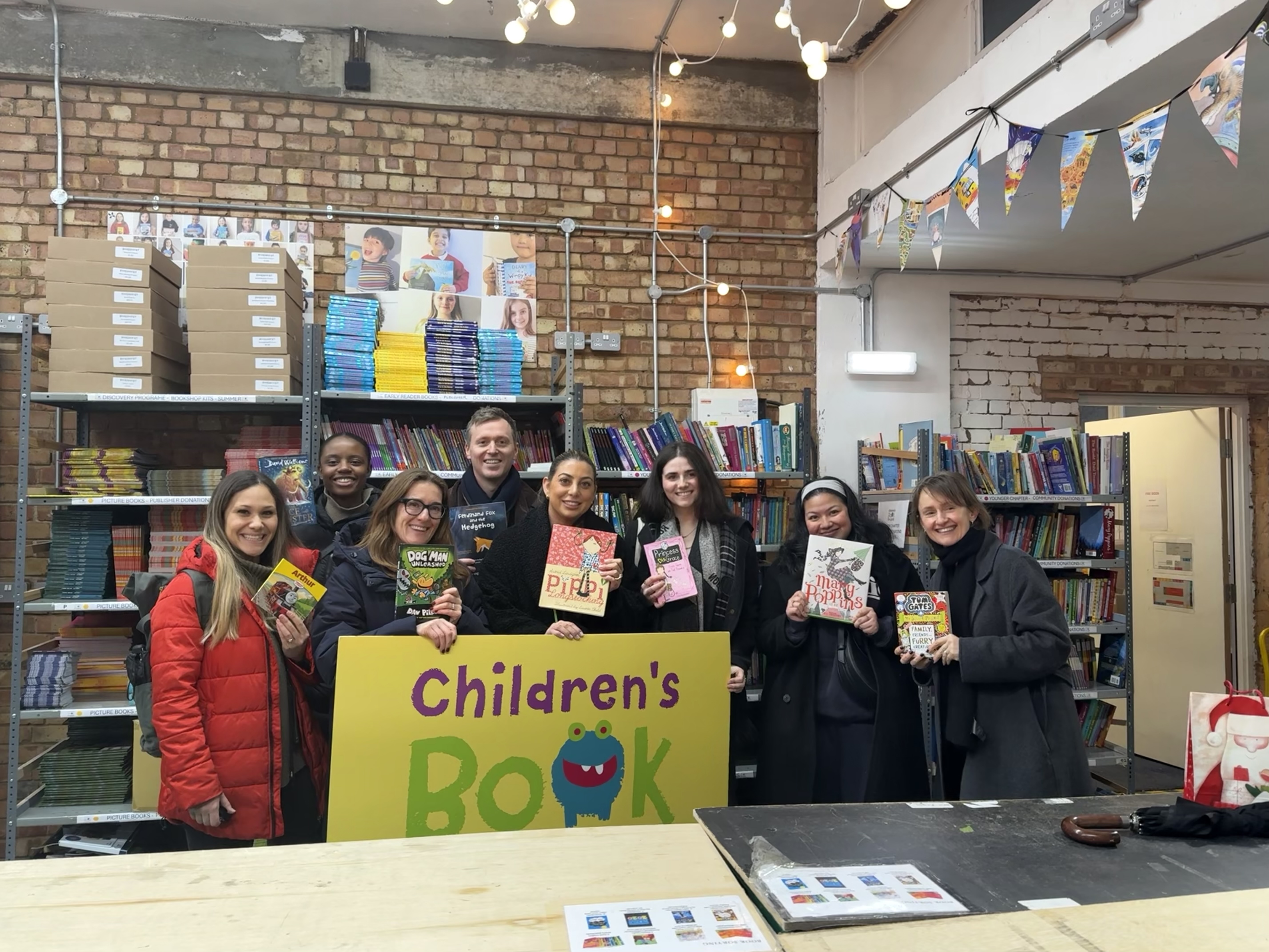 Group photo of William Blake Group employees volunteering at The Children’s Book Project in London.