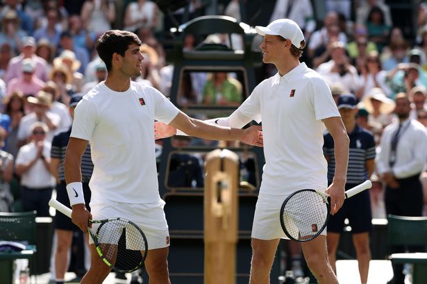 Carlos Alcaraz of Spain and Jannik Sinner of Italy meet at the net prior to the Gentleman's Singles Final on day fourteen of The Championships Wimbledon 2025 at All England Lawn Tennis and Croquet Club on July 13, 2025 in London, England.