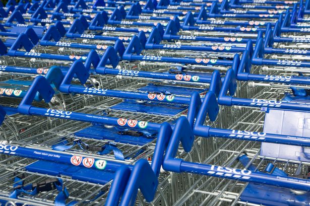 An image of Tesco branded supermarket trolleys