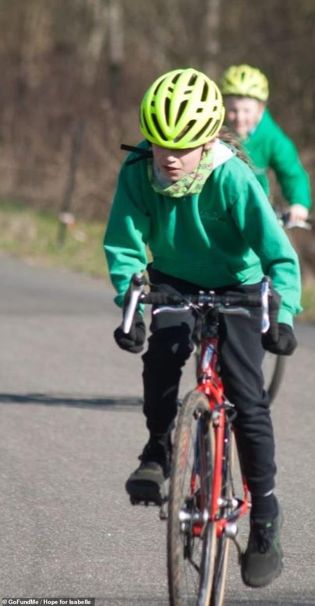 Isabelle's father Mr Vella said: 'The ironic thing is that prior to the appointment she had asked us "is it cancer?" and we had told her not to be so ridiculous' (Pictured: Isabelle competing in a triathlon event prior to her diagnosis)