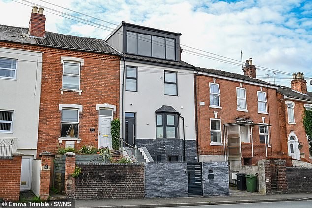 A wall and intercom system was installed at the front of the house while a large dormer was built on top of the two-storey property