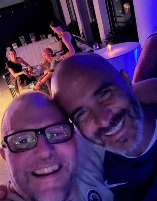 Maresca is seen later in the evening with his arm around Chelsea photographer Darren Walsh