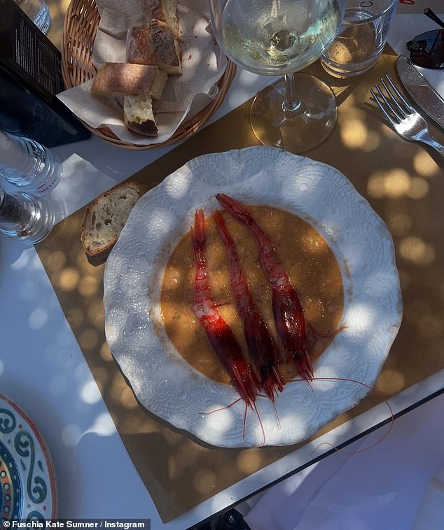 Guests dined on pasta, ciabatta, fresh fish, lobster and vegetables and toasted the couple underneath elegant fairy lights