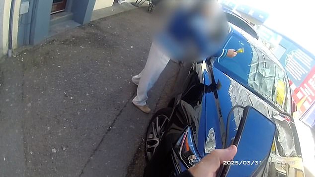 Footage from the officer¿s body-worn camera shows the driver launching the fine to the floor before hurling verbal abuse at the official.