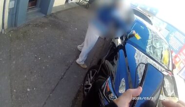 The woman grabbed the parking ticket and then threw it unto the floor