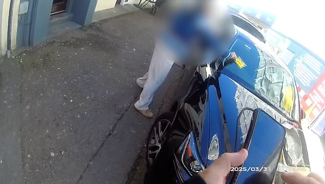 The woman grabbed the parking ticket and then threw it unto the floor