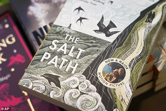 A copy of "The Salt Path", by Raynor Winn is on display in a book store, in London