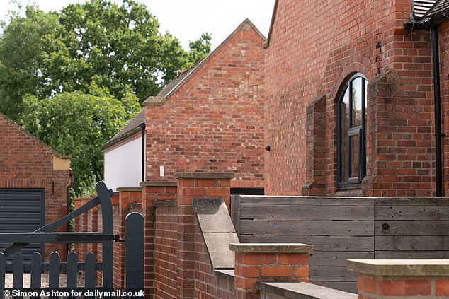 The huge new annex is visible from ground level on the residential street