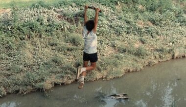 Generations of families played in Coldwater Creek which has resulted in thousands of people developing life-threatening cancers and other illnesses Pictured: A 1980s picture of a boy using a rope swing to jump into Coldwater Creek