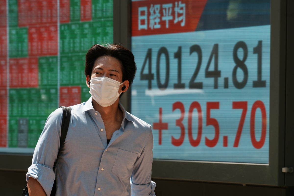 Asian markets are mixed and Japan's shares slip after election leaves Ishiba's future in doubt