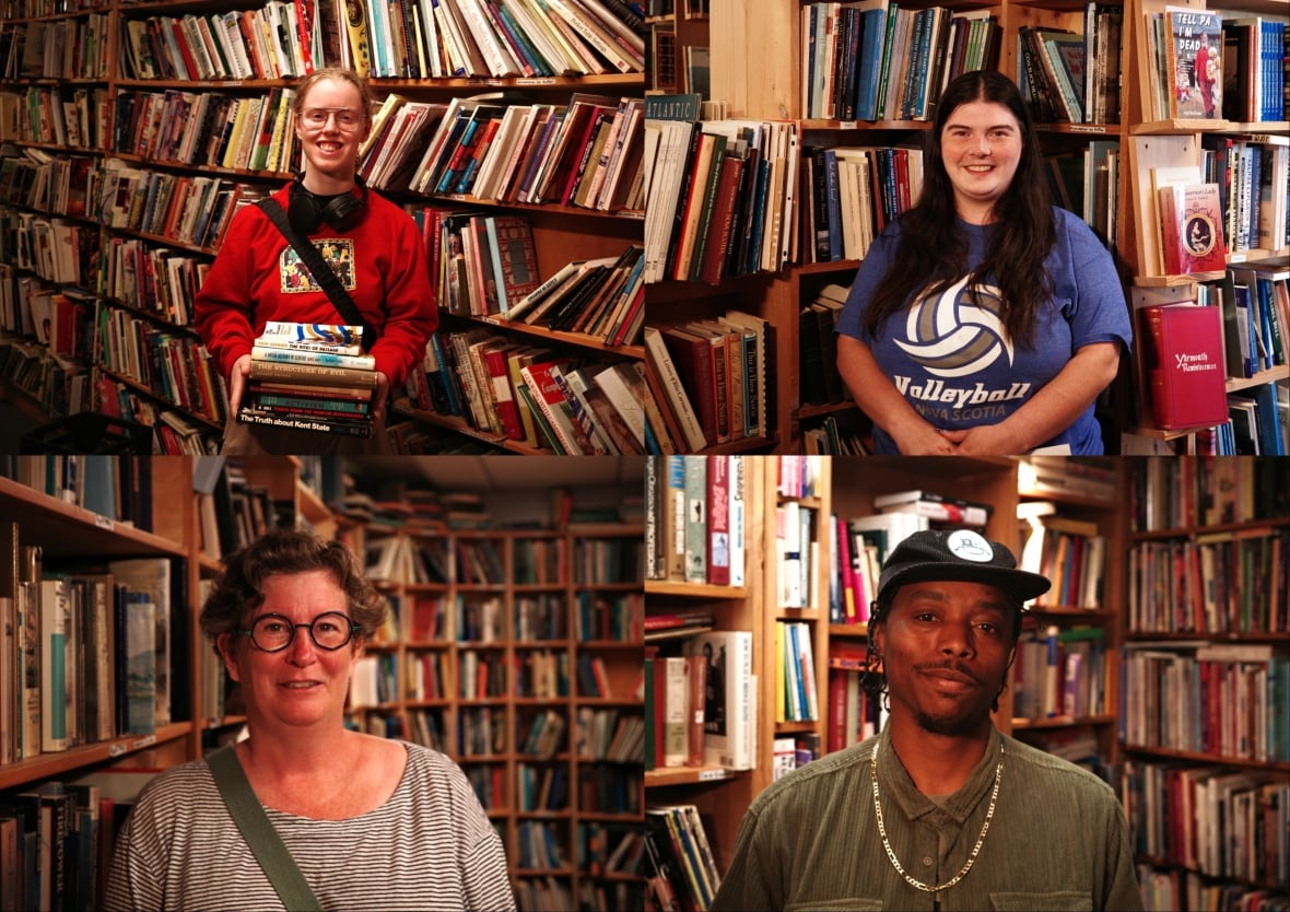 Four individuals stand inside a book store. 