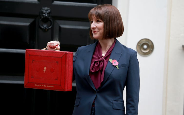 uk chancellor rachel reeves holds up red budget briefcase outside no 10 downing street