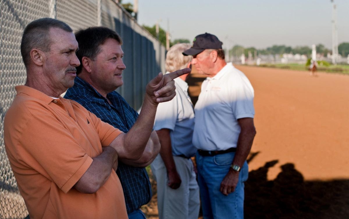 Garry Simms Sr. with trainer Greg Foley at Churchill Downs in 2011. Photo courtesy the Louisville Courier-Journal.