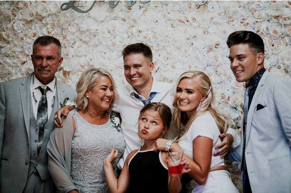 Garry Simms Sr. with his family at daughter Ashley Larson's 2019 wedding. From left: Garry Sr., wife Dianna, son Garry Jr., Ashley, son Zack. In front: granddaughter Kaelyn Whitehouse. Photo courtesy of Simms family.